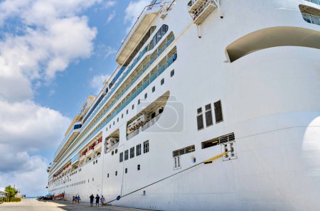 Photo for Cruise ship anchored in the port, preparing to set sail. Side view of a cruise ship, vacation - Royalty Free Image