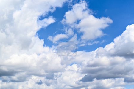Photo for White clouds in a bright blue sky. The beauty of the nature - Royalty Free Image