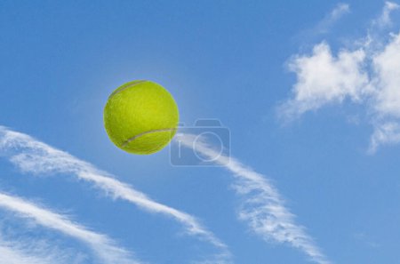 Photo for Tennis ball in the air against blue sky and white clouds - Royalty Free Image