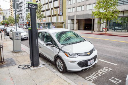 Photo for Los Angeles, CA, USA - October 15, 2022: BlueLA Blink mobility sharing system Electric car being recharged at a car sharing location in downtonwn - Royalty Free Image