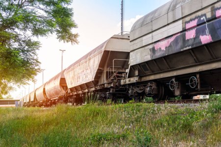 Foto de Low angle view of a cargot train stationary in a shunting yard at sunset. Bremen, Germany - Imagen libre de derechos