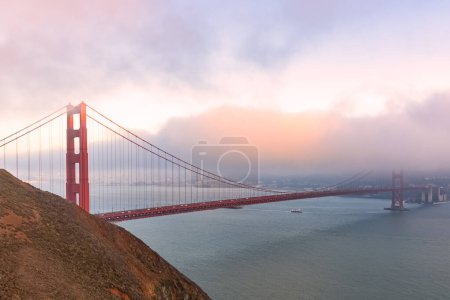Photo for Foggy autumnal sunset over Golden gate bridge. San Francisco, CA, USA. - Royalty Free Image