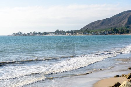 Photo for Bay along the coast of Califronia on a partly cloudy autumn day. Oceanfront houses are visible in distance. - Royalty Free Image