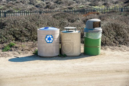 Photo for Row of recycling bins in a park on a sunny autumn day. Monterey, CA, USA. - Royalty Free Image