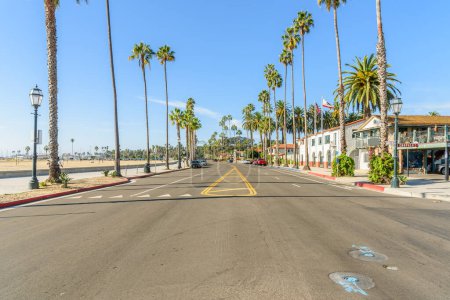 Photo for Beachfront street lined with palm trees on a sunny autumn morning. Santa Barbara, CA, USA. - Royalty Free Image