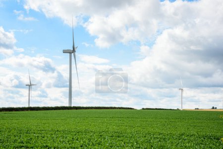 Photo for Wind farm in a rural landscape in England on a partly cloudy summer day. South Yorkshire, England, UK - Royalty Free Image
