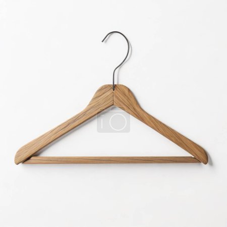 Minimalistic image of a single wooden clothes hanger isolated on a clean white background