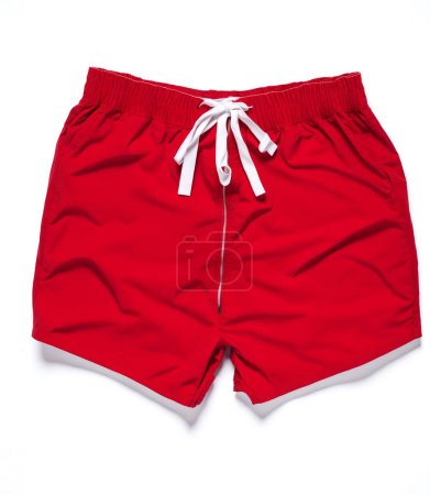 Vibrant red swimming trunks with drawstring on a clean white backdrop