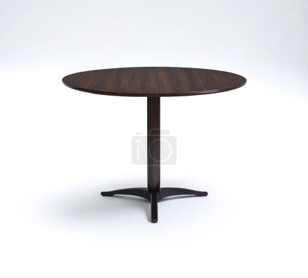 Elegant contemporary round table with wooden top and dark base isolated on a white backdrop