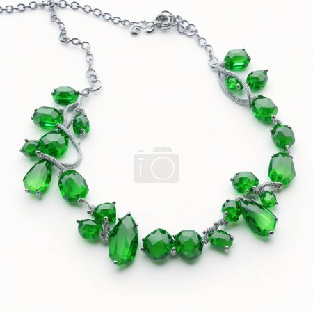 Luxurious green gemstone necklace with silver chain isolated on a pure white backdrop