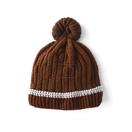 Brown knitted hat with a white stripe and pom-pom isolated on a white backdrop, symbolizing warmth