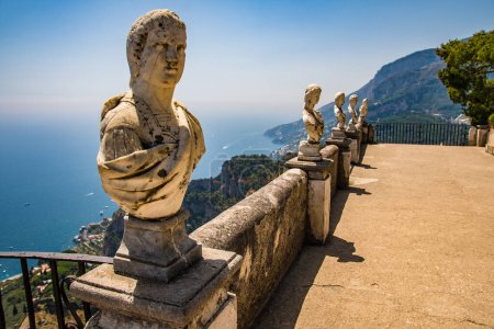 Photo for Statues line the terrace of Infinity at the gardens of Villa Cimbrone, Ravello, Italy on the Amalfi Coast. Blue skies above and the Mediterranean Sea below. - Royalty Free Image