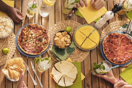 Photo for Overhead shot of wooden table decorated with food - Royalty Free Image