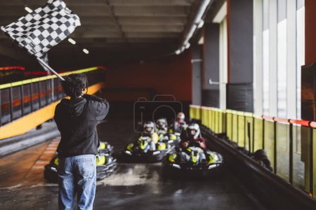 Photo for Waving the checkered flag on the kart circuit - Royalty Free Image