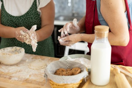 Photo for Close up detail of hands kneading cookies - Royalty Free Image