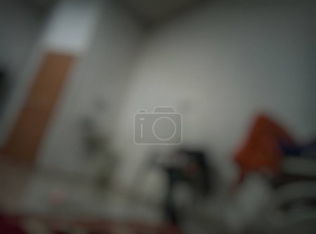 Bokeh. State of in-patient room at Curup Clinic, Bengkulu, Indonesia. The photo is slightly blurred at night. Leading to the toilet door