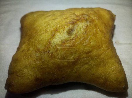 In the Java region of Indonesia, this is a very popular food. Odading or bolang-baling or kue bantal, fried bread, is a traditional Indonesian food.