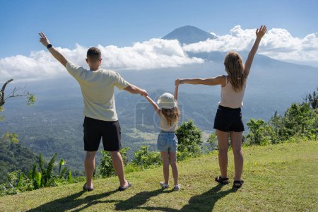 Photo for Family enjoying view of volcano in Bali, Indonesia - Royalty Free Image
