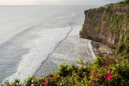 Photo for View of Uluwatu temple of top of the cliff, in Uluwatu, Bali, Indonesia, ocean landscape. - Royalty Free Image