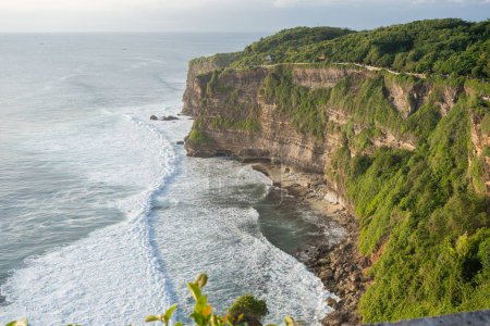 Photo for View of Uluwatu temple of top of the cliff, in Uluwatu, Bali, Indonesia, ocean landscape. - Royalty Free Image