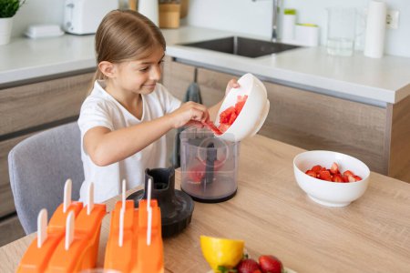 Photo for Child girl making ice cream at home, fruit ice lollipops - Royalty Free Image