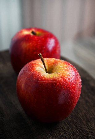 Photo for Red apples on a wooden board - Royalty Free Image