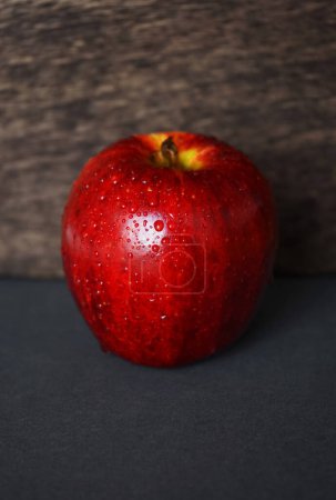 Photo for Red apple on wooden background - Royalty Free Image