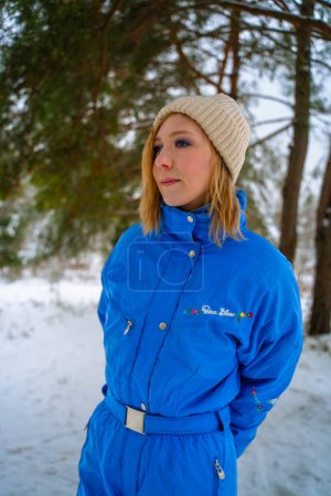 Photo for Girl in blue overalls in winter - Royalty Free Image