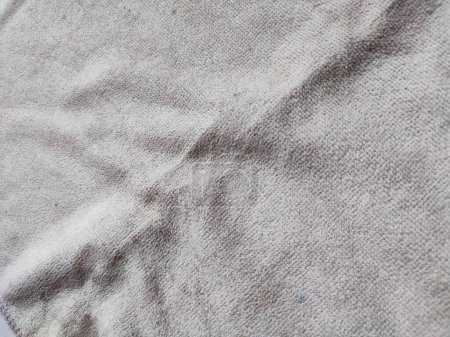 texture, pattern, background of dirty white towel exposed to sunlight