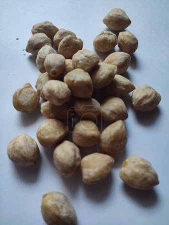 Candlenut or kukui as one of the important cooking ingredients in Indonesia isolated on a white background