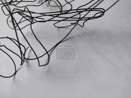tangled black wire isolated on white