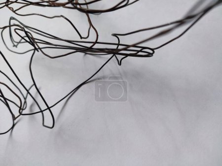 tangled black wire isolated on white