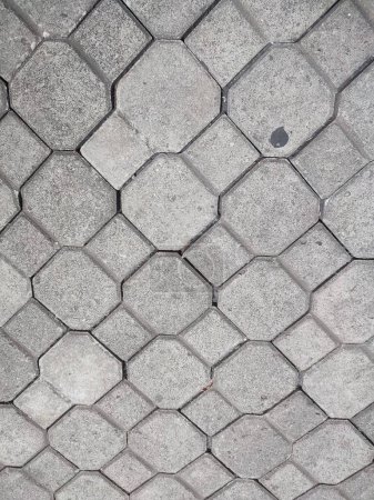 Pavement stone background. Texture of paving stones laid on a city street