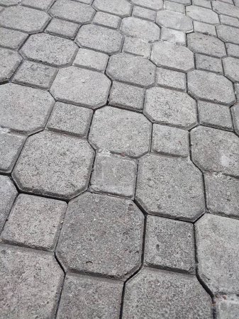 Fondo de piedra pavimentada. Textura de adoquines colocados en una calle de la ciudad