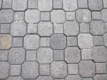 Pavement stone background. Texture of paving stones laid on a city street