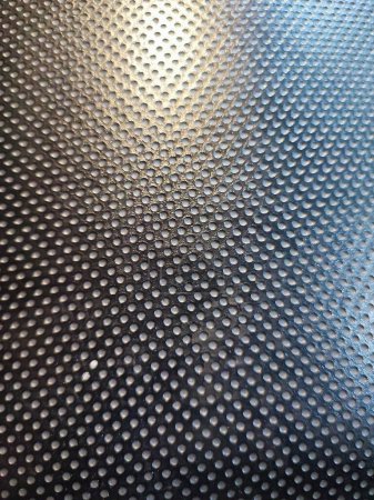 Black perforated polyurethane PU material texture for background