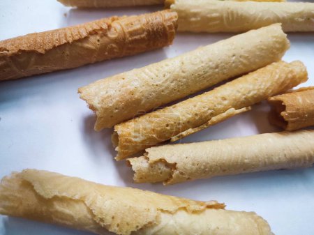 Kue semprong or Asian egg roll. This is a traditional Indonesian wafer or kuih snack isolated on a white background