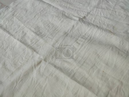 Tissu toile de fond toile de lin blanc froissé tissu de coton naturel lin naturel fait à la main vue du dessus fond bio Eco textiles blanc Tissu texture lin