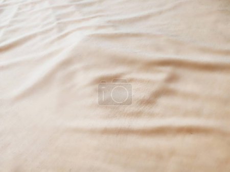 texture and background of wrinkled cream fabric