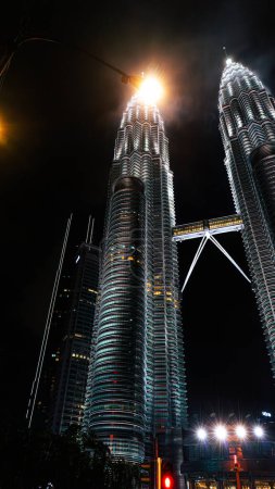 Photo for Petronas Tower The tallest and most modern construction building The twin towers are strangely shaped like rockets. Popular destinations for travelers and tour groups in Malaysia. - Royalty Free Image