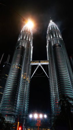Photo for Petronas Tower The tallest and most modern construction building The twin towers are strangely shaped like rockets. Popular destinations for travelers and tour groups in Malaysia. - Royalty Free Image