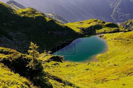 Photo for Alpine Majesty: Summer at Grand Arc, Maurienne, French Alps. This scenic image captures the breathtaking beauty of a serene mountain lake nestled within the Grand Arc massif in the Maurienne region of the French Alps. - Royalty Free Image