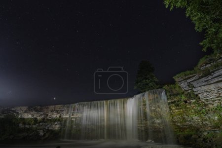 Téléchargez les photos : Night scene, Estonian nature, Jagala waterfall and starry sky. High quality photo - en image libre de droit