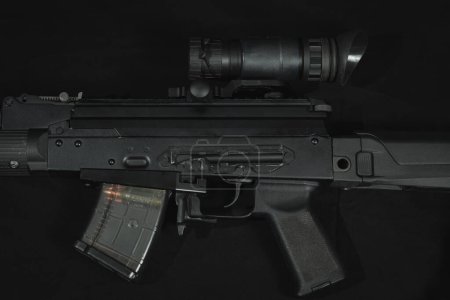 AKM assault rifle with night vision device, close-up photo. High quality photo