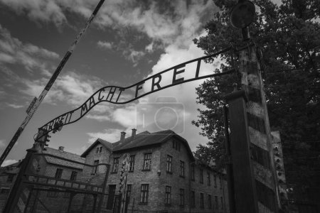 Poland, Auschwitz July 25, 2023. Entrance gate to the Auschwitz death camp, black and white gloomy photo. High quality photo