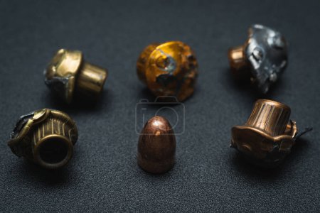 Crumpled spent bullets from a 9mm pistol. High quality photo