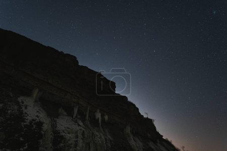 Estonian landscape. Paldiski cliff on a winter night with a clear sky with stars. High quality photo