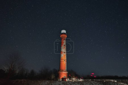 Lighthouse in Paldiski peninsula against the backdrop of the starry sky, photo with weak lighting. 