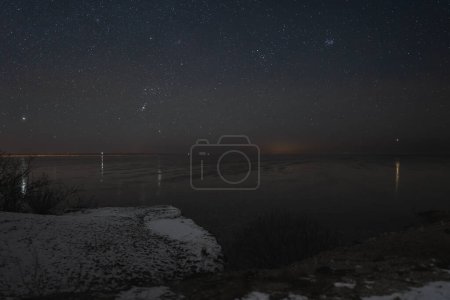 Night scene, view from the sea cliff of Paldiski peninsula in winter, landscape astrophotography. 