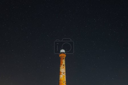 Lighthouse in Paldiski against the backdrop of the starry sky, photo with weak lighting. High quality photo